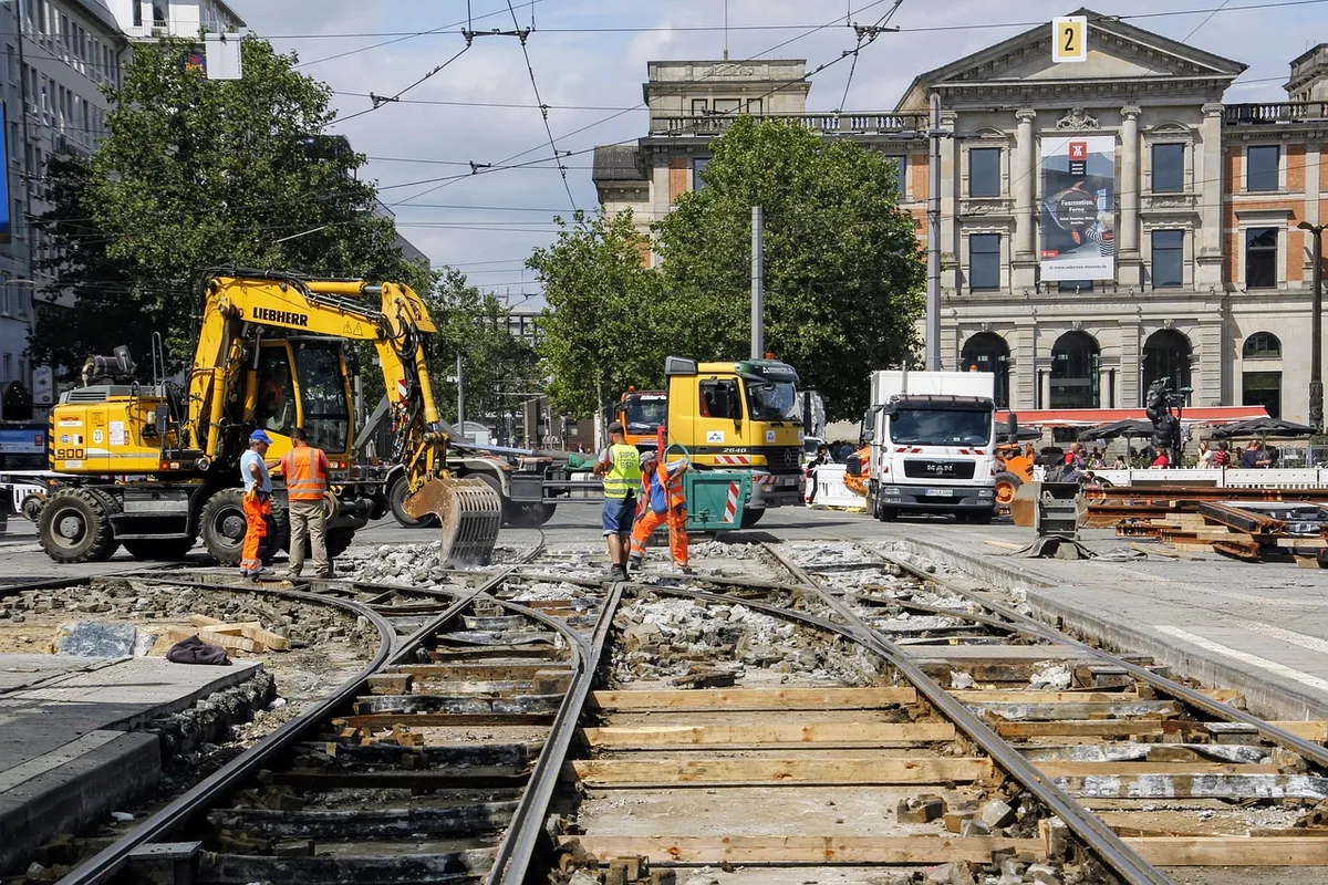 construction site, construction worker, tram, traffic, concrete, excavator, major construction site, construction work, building area, road, rails, rail replace