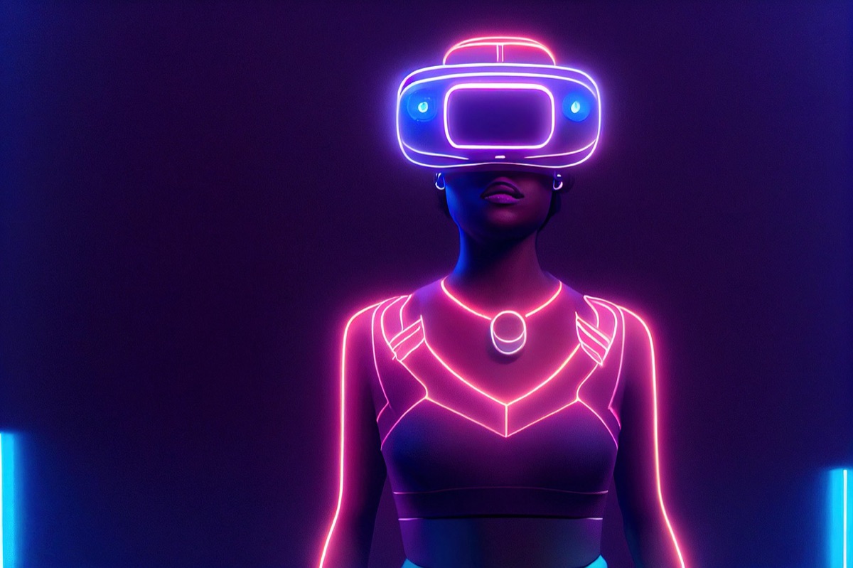 Instructional designer with VR headset and monitor